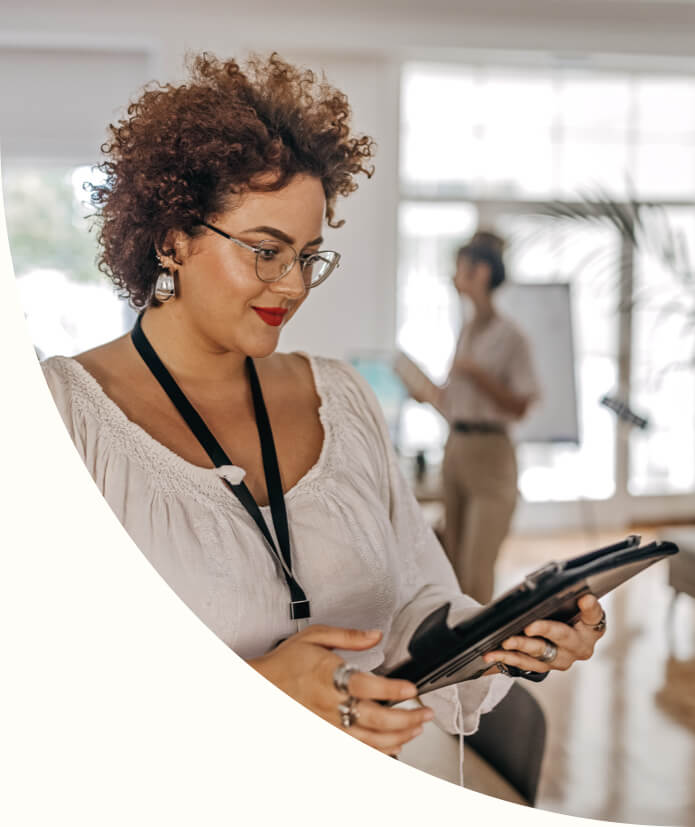 Happy businesswoman using digital tablet