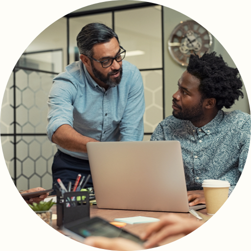 two colleagues working together on a laptop